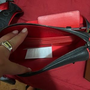 This is a NEW and never used Christian Louboutin bag (unisex).